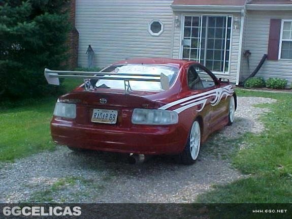 Completed installation on red Celica showing overall rear appearance