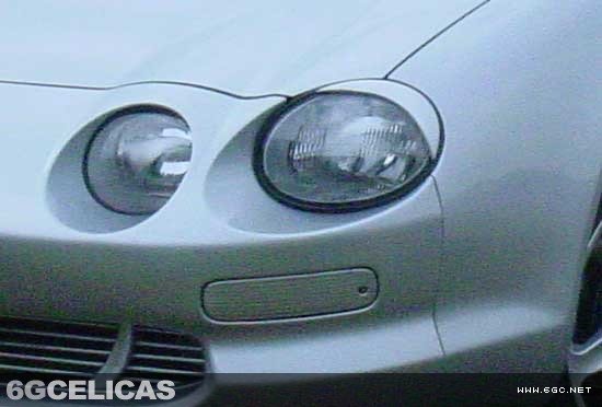 Completed headlight eyebrows installed on silver Celica
